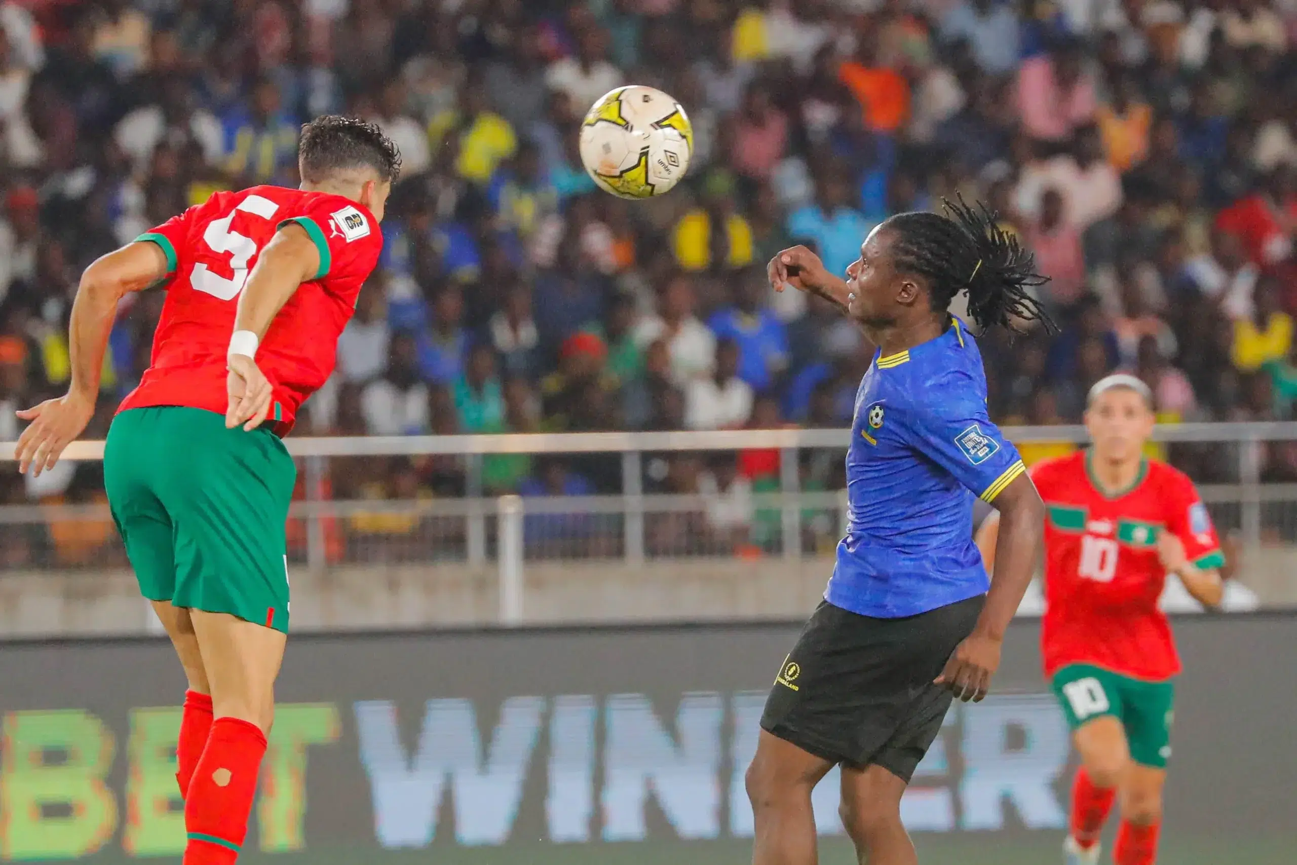 Denis Kibu of Tanzania and Nayef Aguerd of Morocco during the 2026 FIFA World Cup Qualifiers