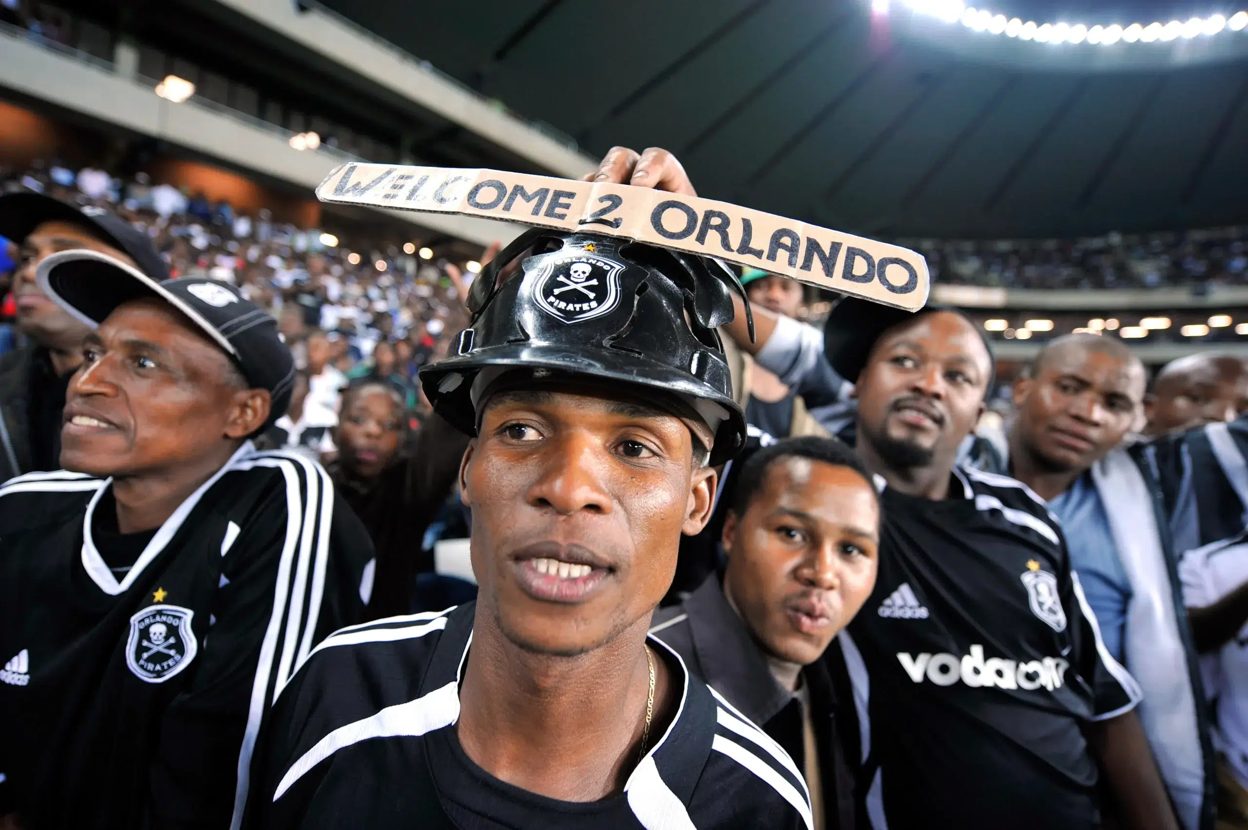 Supporters of Orlando Pirates cheers their team during the soccer match