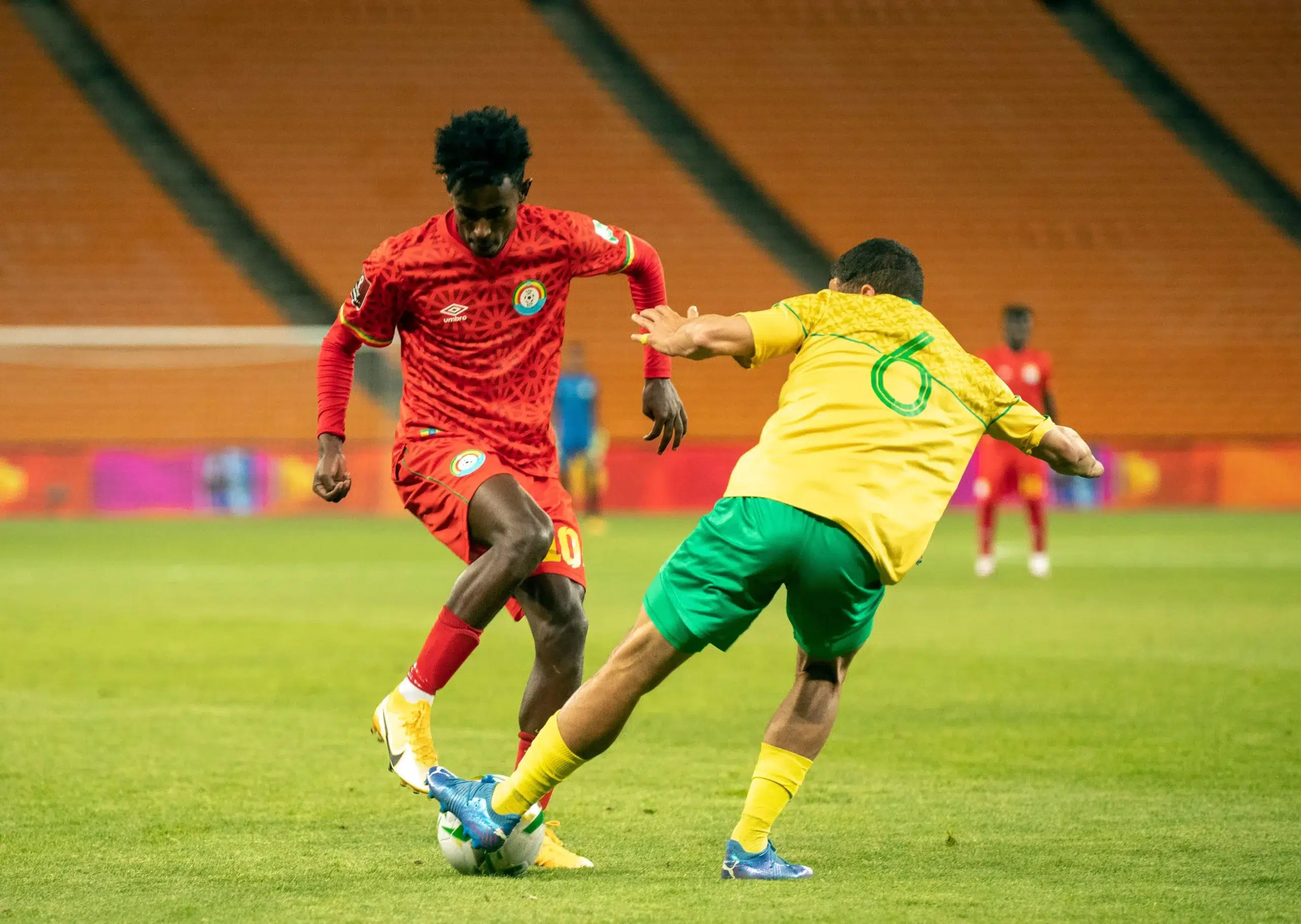 Ethiopia's Abubeker Nassir, left, is challenged by South Africa's Yusuf Maart during the World Cup 2022 group G qualifying soccer match