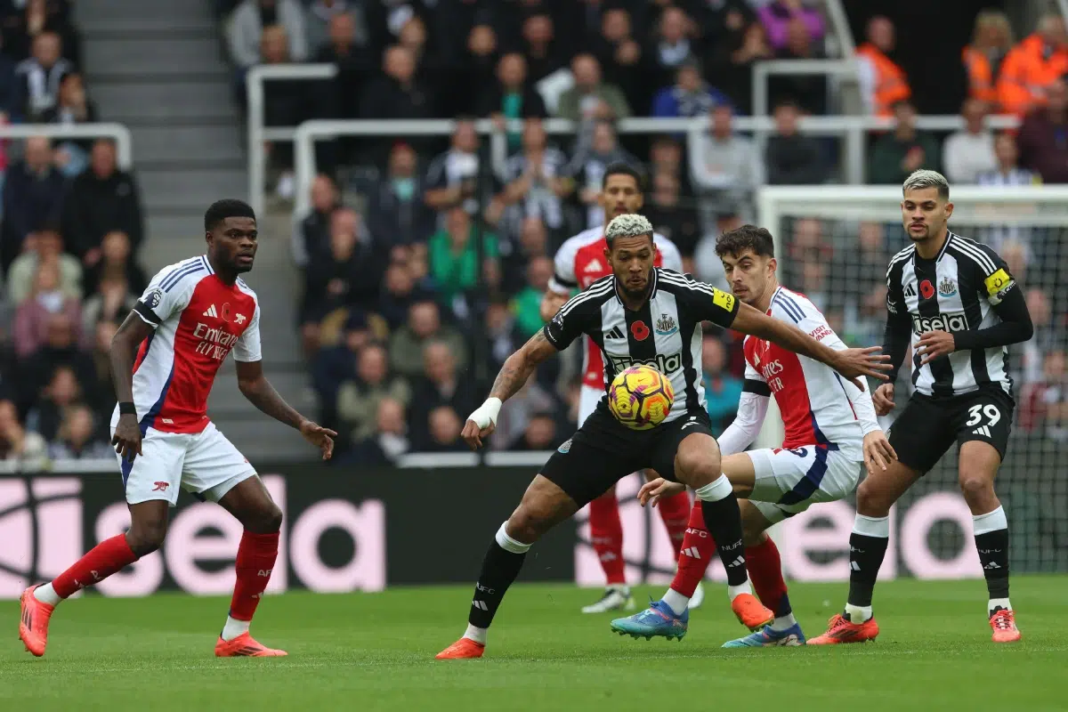 Newcastle United's Joelinton battles for possession with Arsenal's Kai Havertz, 2024