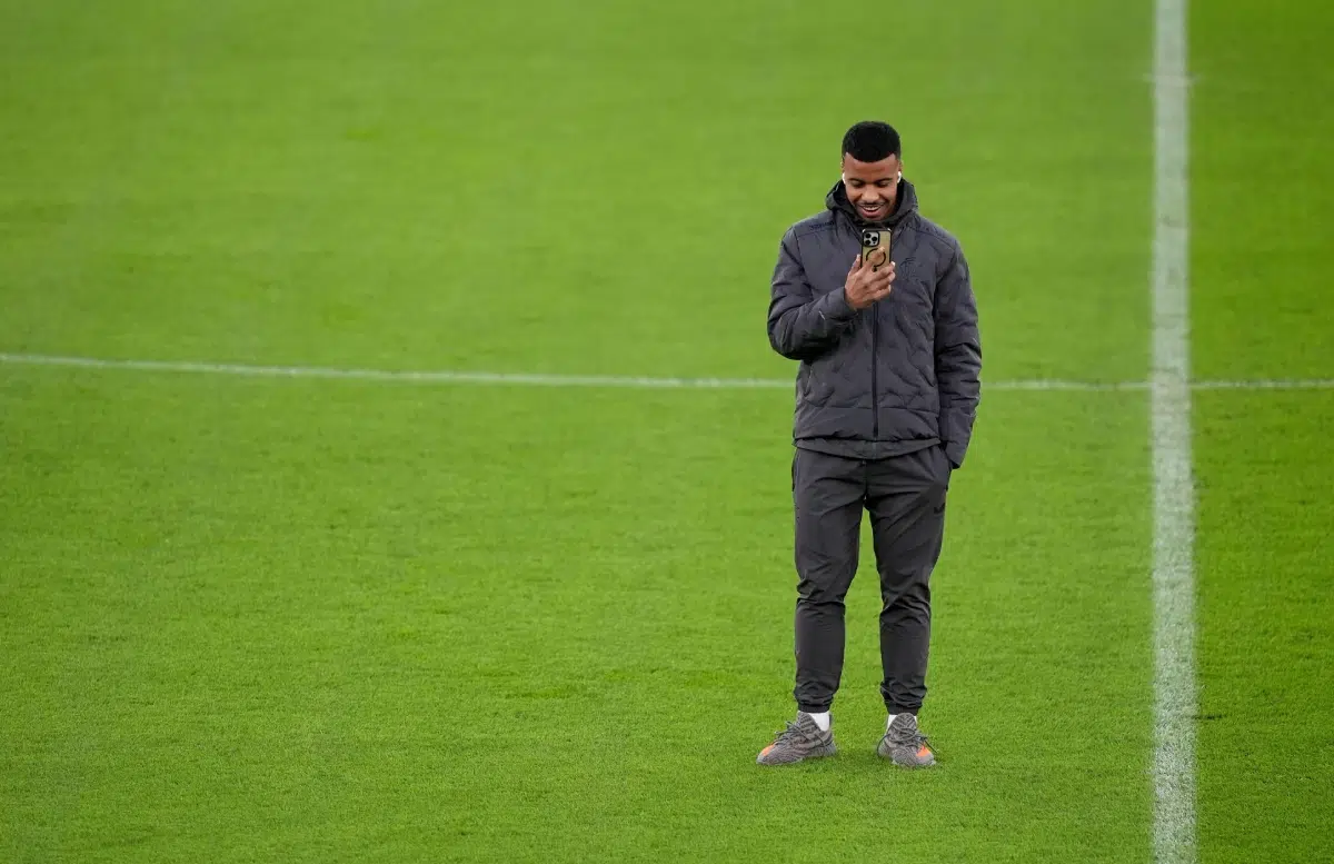 Hamza Igamane inspects the pitch before a press conference at Old Trafford, Manchester