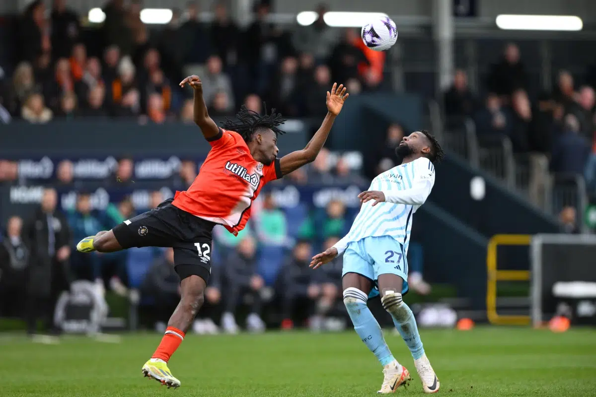 Issa Kabore of Luton Town and Divock Origi of Nottingham Forest, 2024