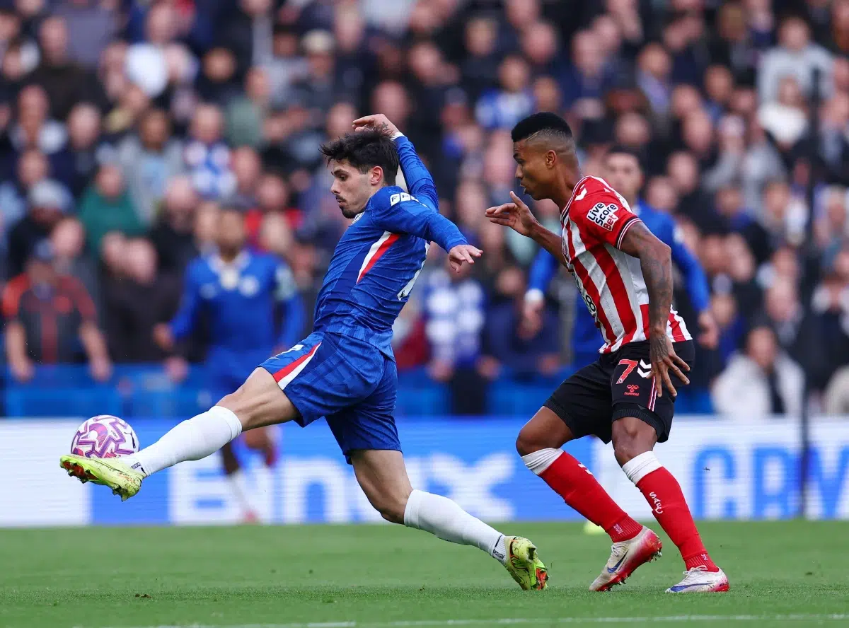Pedro Neto of Chelsea and Reinildo Mandava of Sunderland during the Chelsea vs Sunderland Premier League match, 25th Oct, 2025