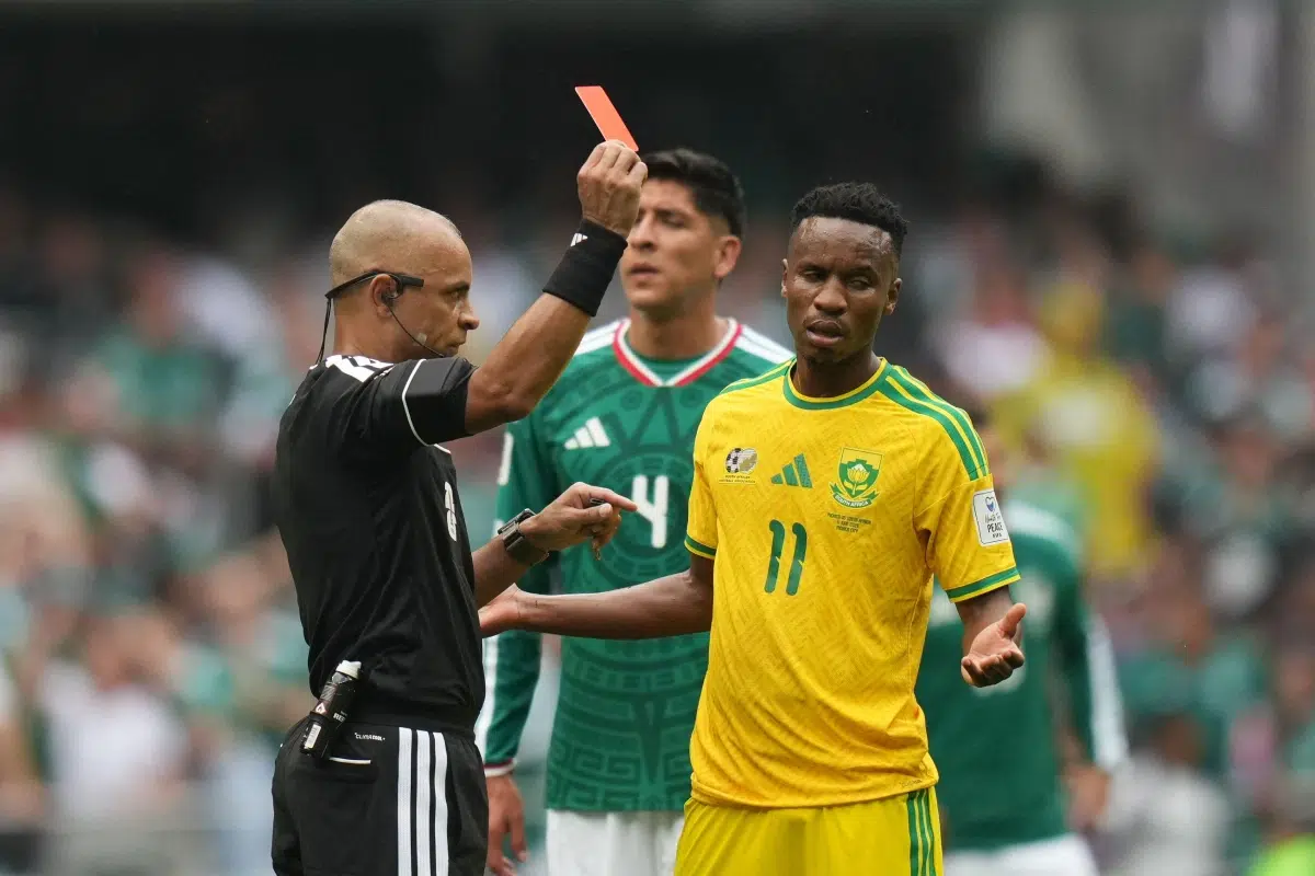 Referee Wilton Sampaio shows the red card to Zwane during the World Cup match, 2026