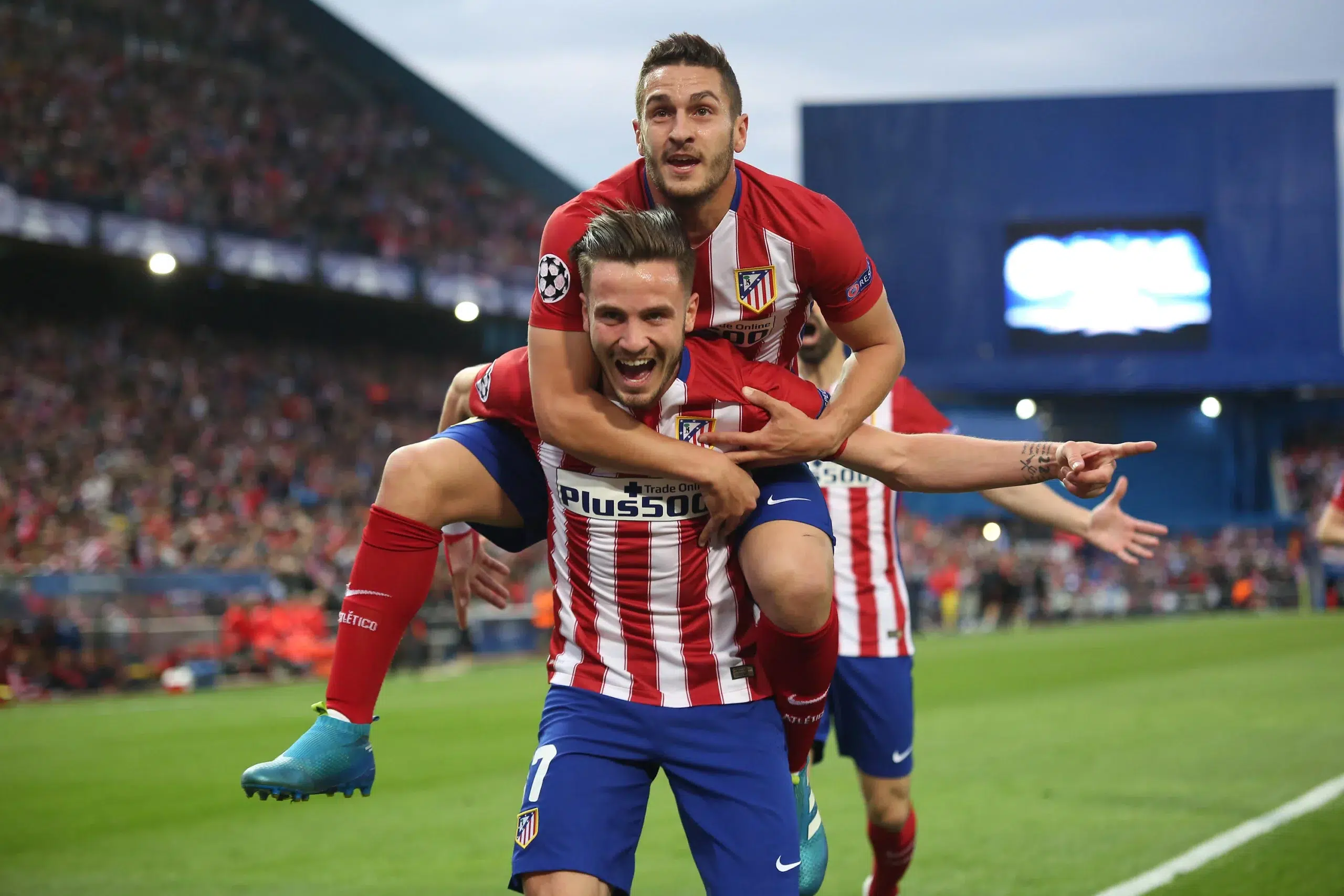 Saul Niguez of Atletico Madrid celebrates with team mates Antoine Griezmann